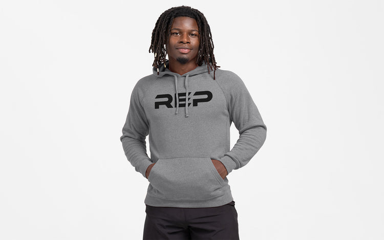 Man wearing Heather Gunmetal Unisex Daily Driver 2.0 Pull Over Hoodie