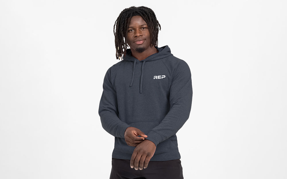 Man wearing Heather Navy Unisex USA Pull Over Hoodie