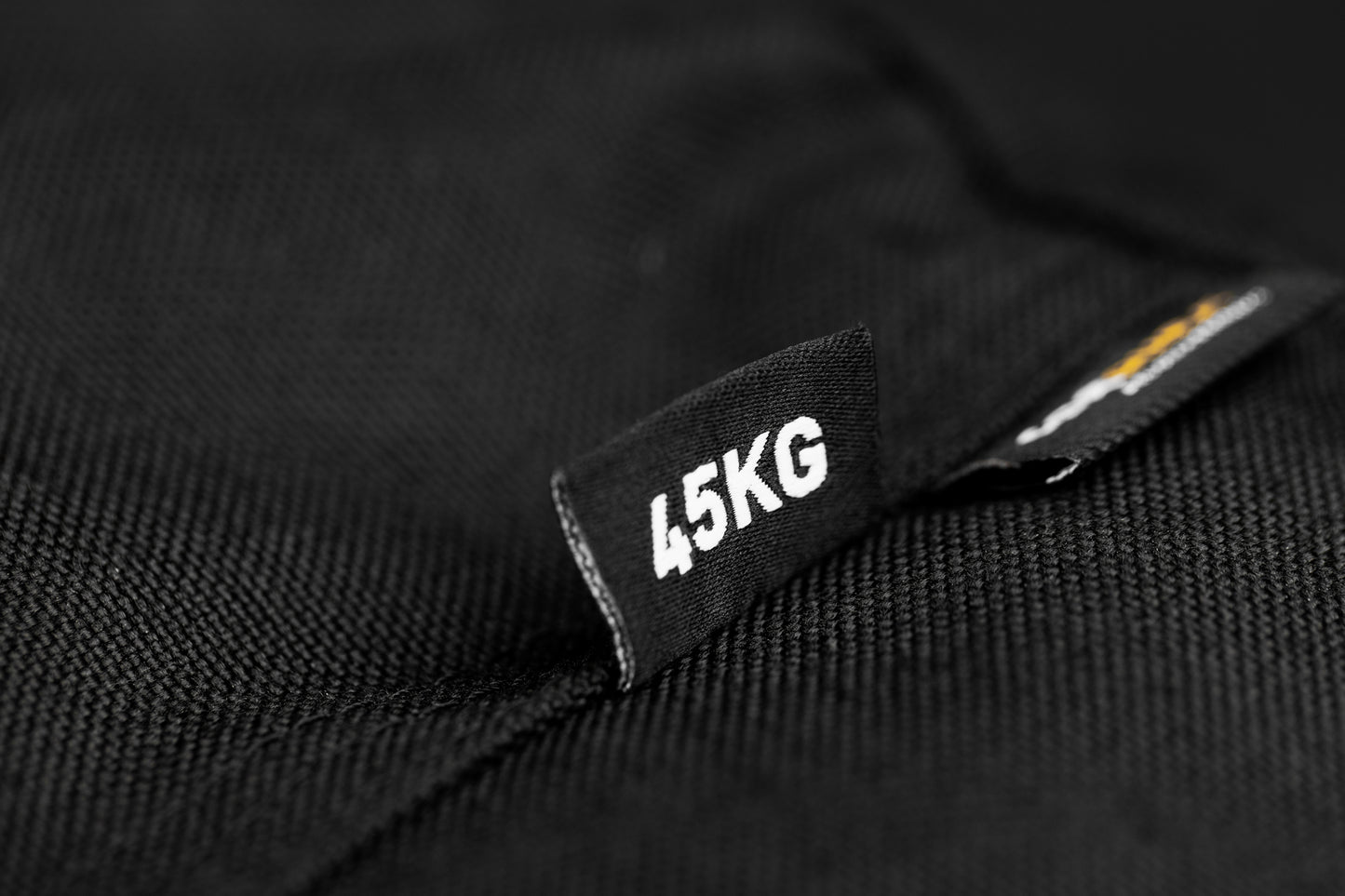 Black label with '45KG' on a black background