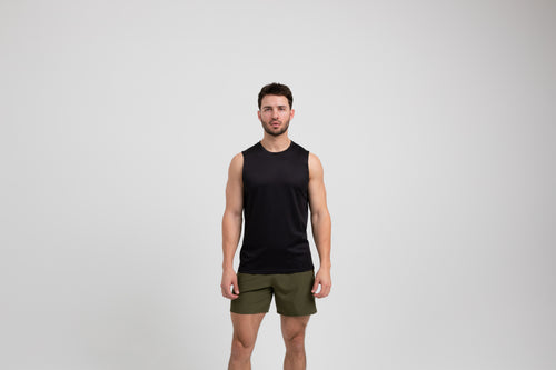 Athlete wearing a black REP Men's Solis Muscle Tee.