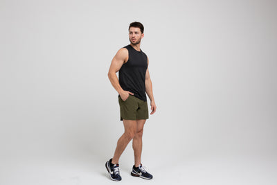 Athlete wearing a black REP Men's Solis Muscle Tee.