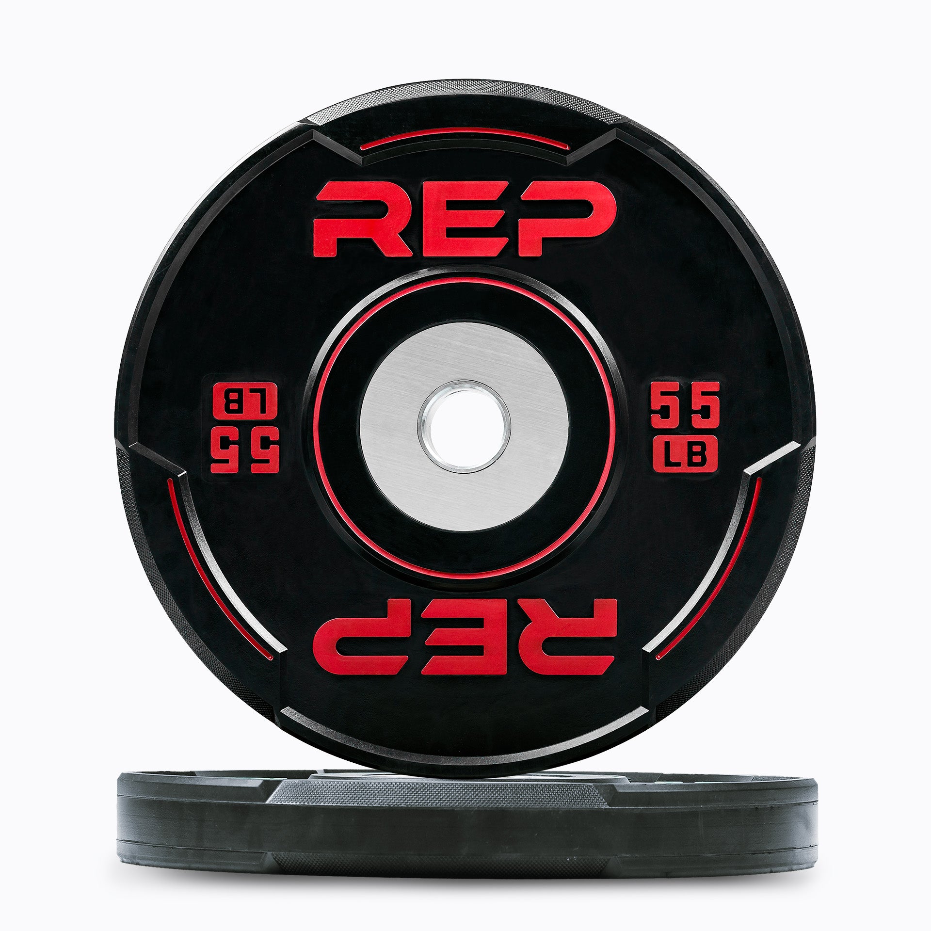 Studio-shot: Front and side profile of a red 55 lb REP Sport Bumper Plate 2.0 on a white background