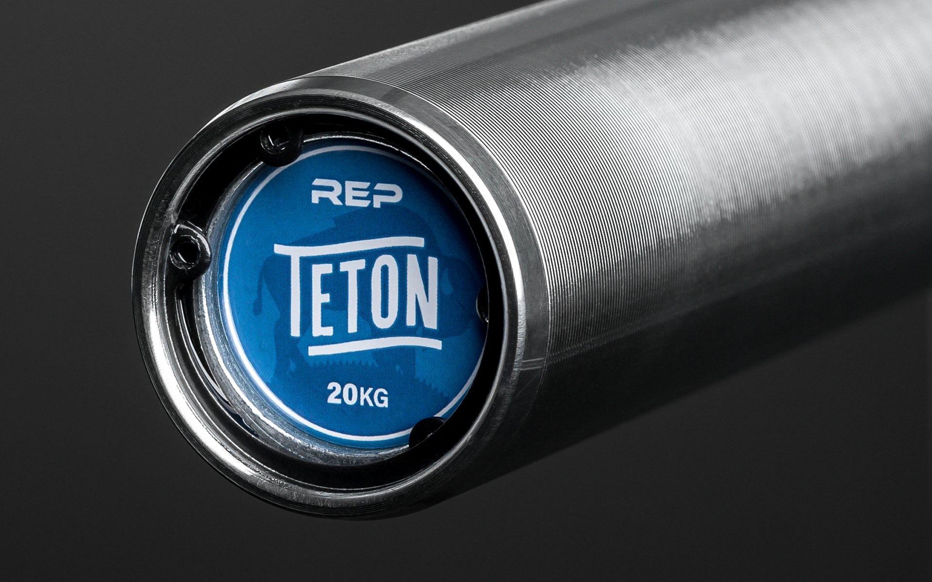 Close-up view of the endcap sticker of a REP Teton Training Bar - 20kg.