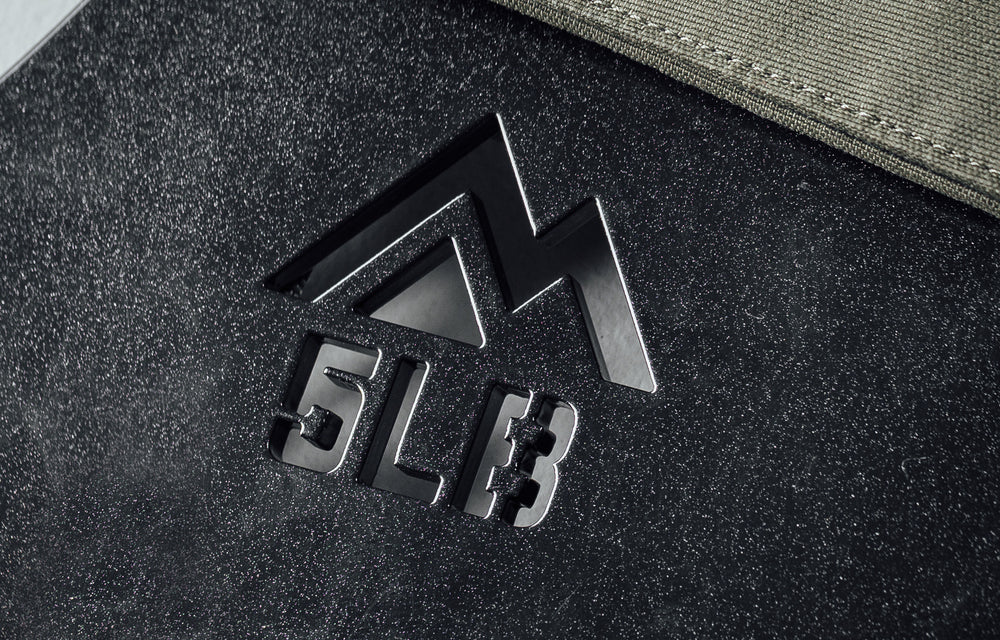 Mountain logo cutout and weight cutout on the Strata Weight Vest Plates