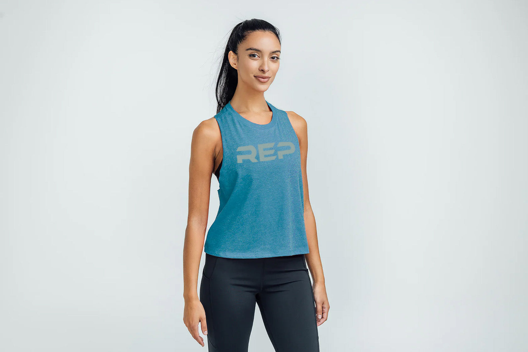 Woman wearing Teal/Aqua Gray Daily Driver Cropped Dual-Blend Tank