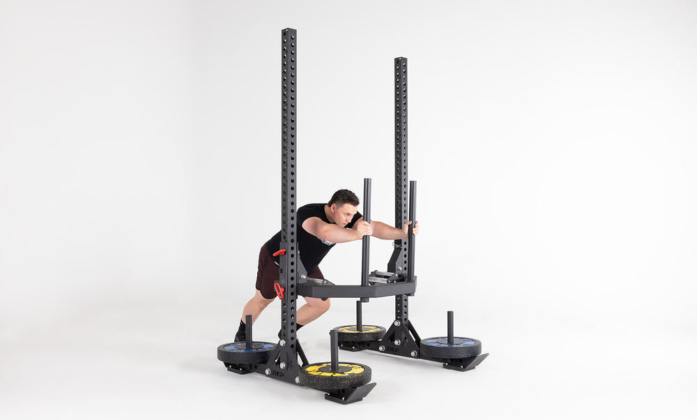 Oxylus Yoke With Carry Attachment Being Used for Sled Push