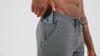 An athlete adjusting their grey Men's Attis Joggers