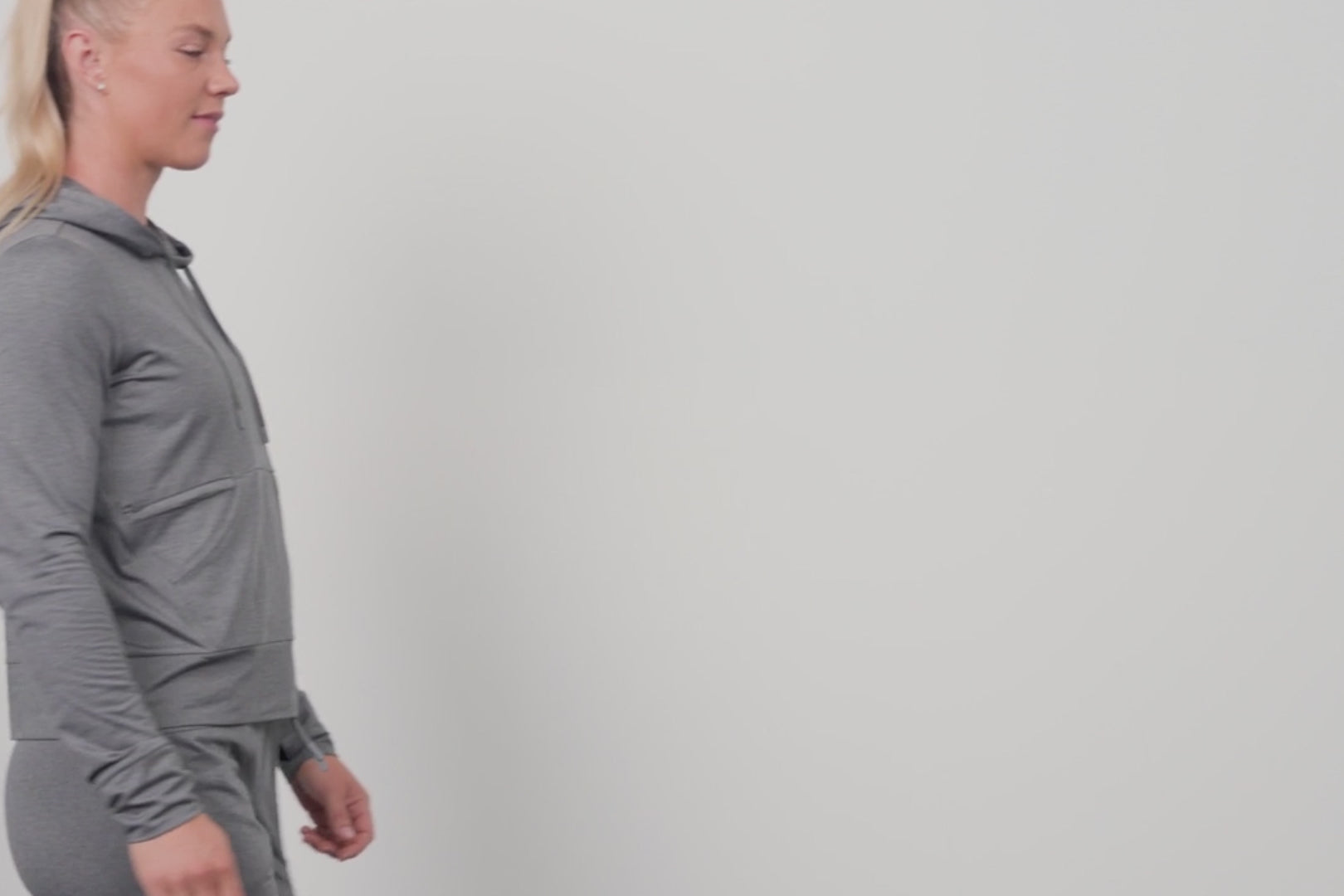 A close-up video of an athlete adjusting the hood of the Women's Vellus Hoodie
