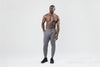 A video of an athlete walking into the shot wearing the grey Men's Apollo Joggers in Heather Cool Gray, Heather Black, Heather Navy