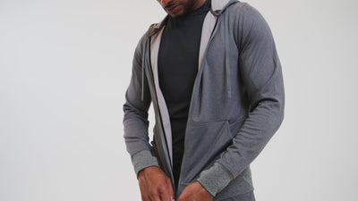 Video showing person using various features of the Attis Jacket in Heather Cool Gray. Also available in heather olive and heather black.