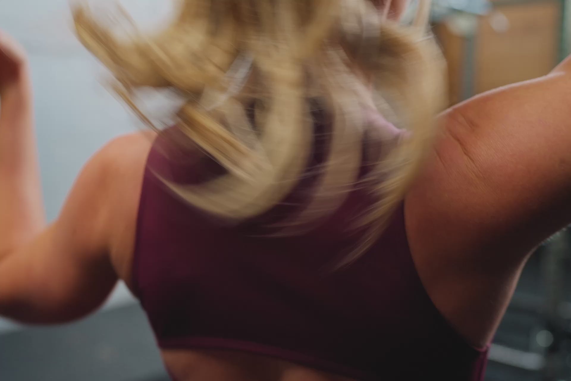 Video of an athlete performing deadlifts while wearing the REP Rhea tank in Wine.