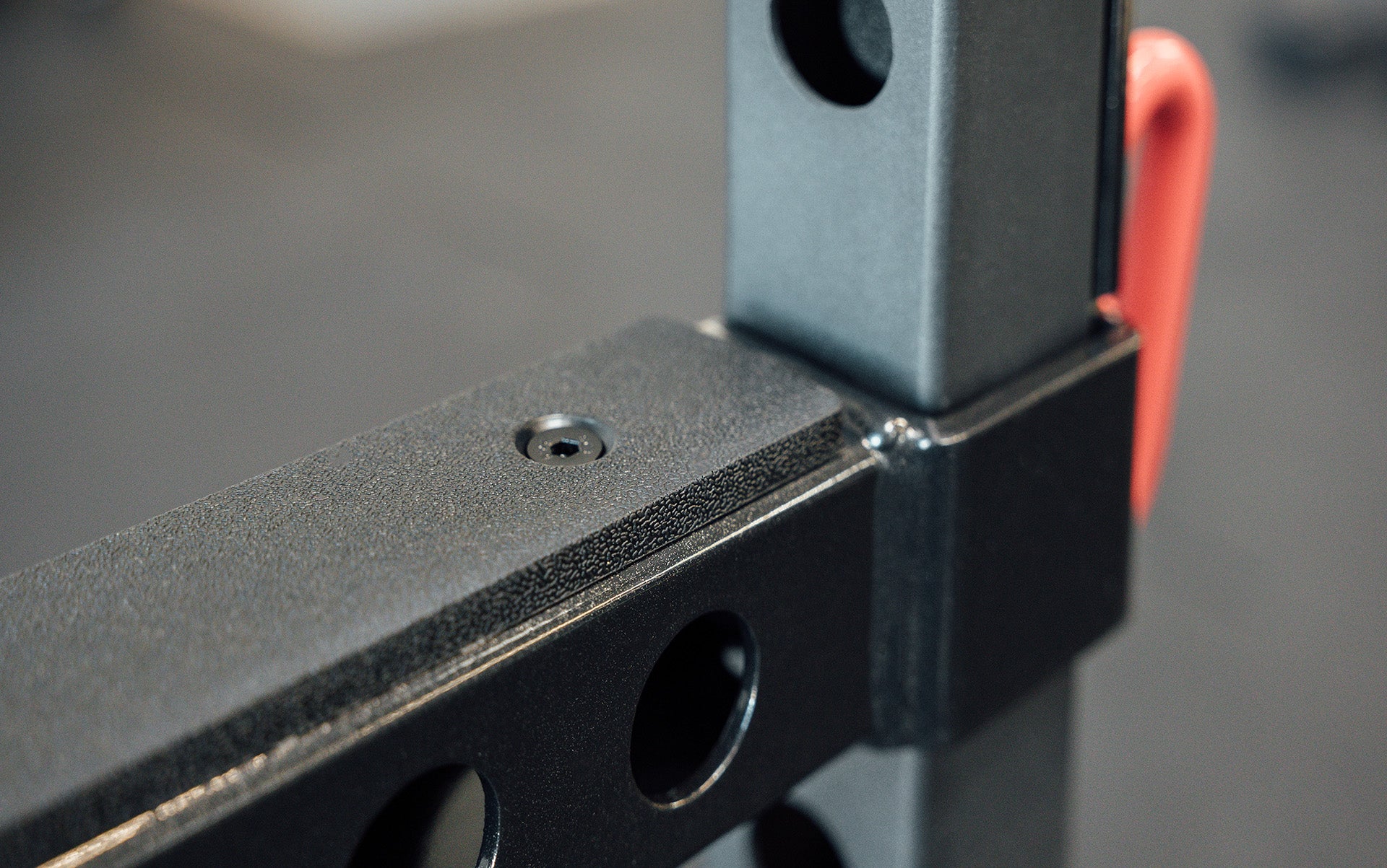 Flip-Down Safeties on 1000 Series Power Rack (Close Up of Plastic Liner on Top)