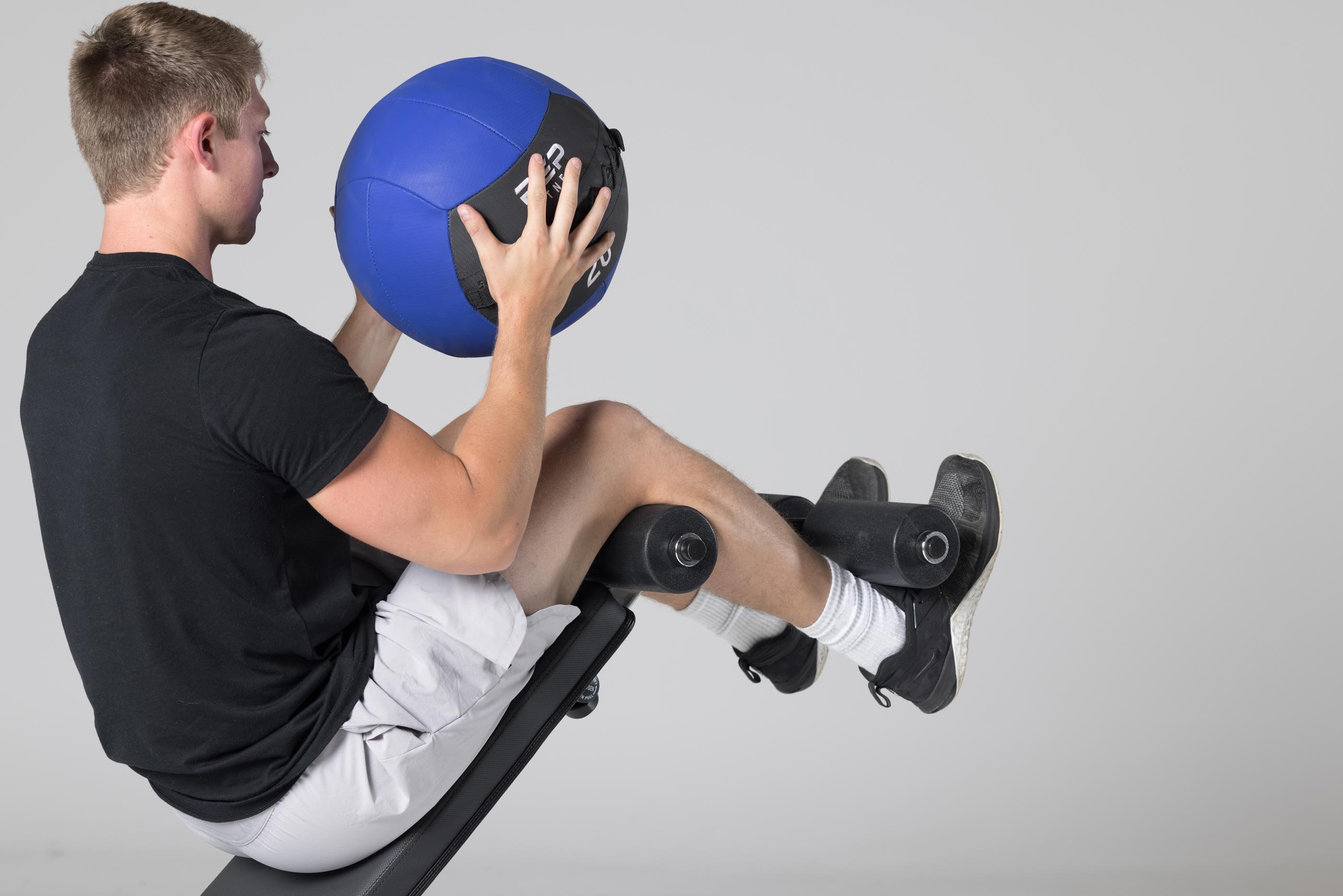 Decline sit-ups using leg roller attachment