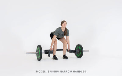 Lifter set up for a deadlift using the open trap bar with narrow handles.