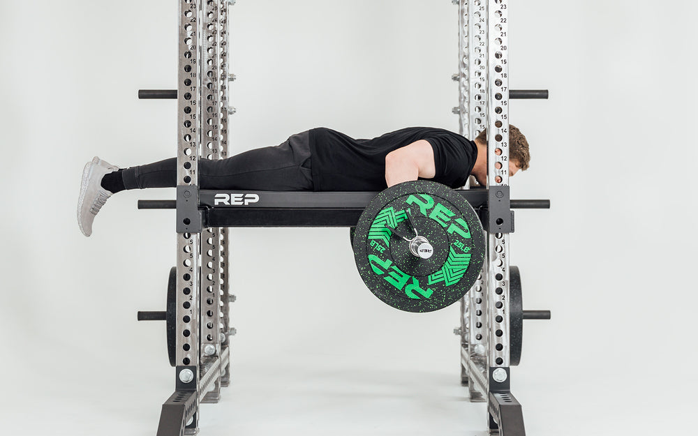 Utility Seat + Pad  Installed on Flip-Down Safeties on Power Rack Being Used for Seal Rows