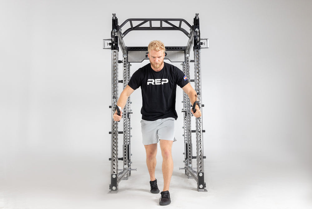 Athena Selectorized Side-Mount Functional Trainer Dual Side Shown on Clear Coat PR-5000 Power Rack Being Used For Chest Flys