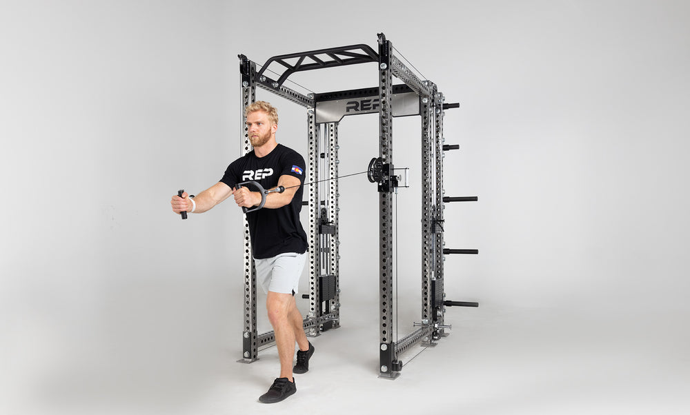 Athena Selectorized Side-Mount Functional Trainer Dual Side Shown on Clear Coat PR-5000 Power Rack Being Used For Chest Flys