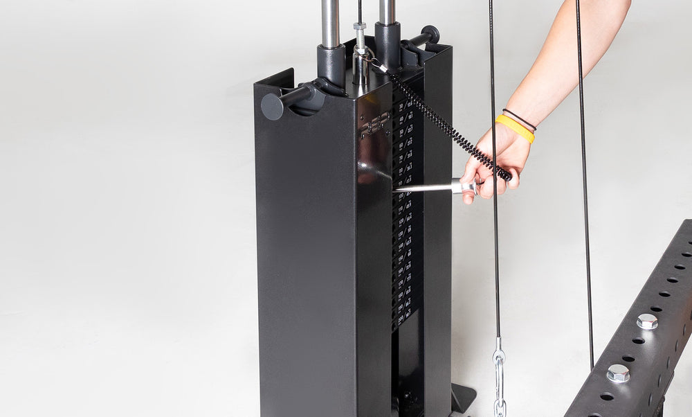 Selectorized Lat Pulldown & Low Row Close Up of Weight Stack and Weight Being Selected With Magnetic Selector Pin