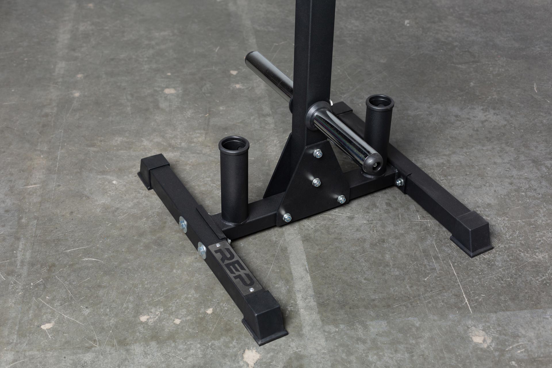 Close-up view of the bottom section of the REP Bar and Weight Plate Tree showing the bottom weight horns and the two barbell holders.