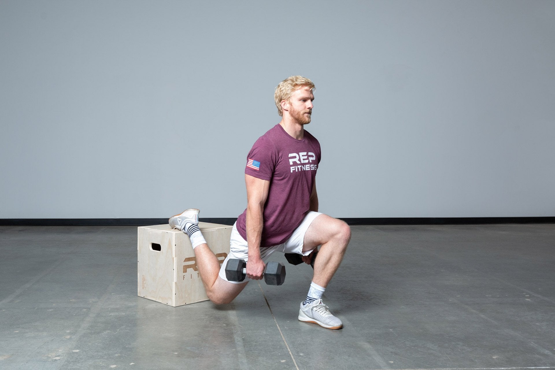 Lifter performing weighted split squats on an In-Between REP 3-in-1 Wood Plyo Box.