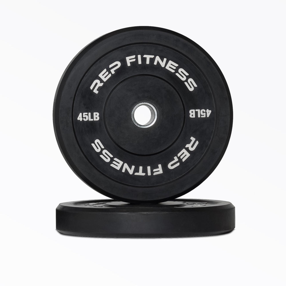 REP Fitness black rubber Olympic bumper plate with a stainless steel center insert on a white background