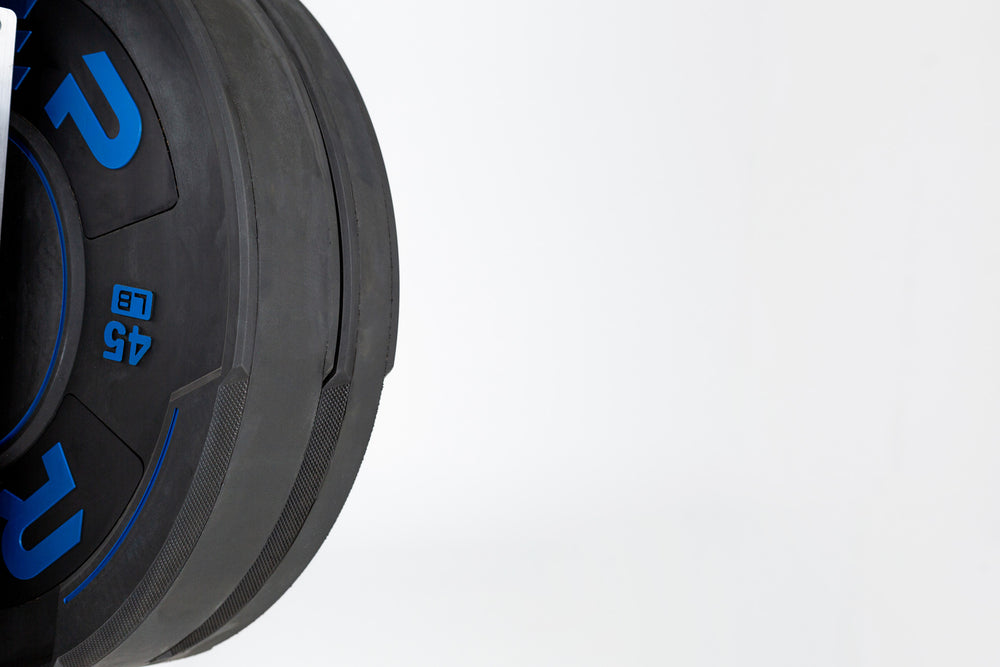 Close-up view of half of a 45lb sport bumper plate.