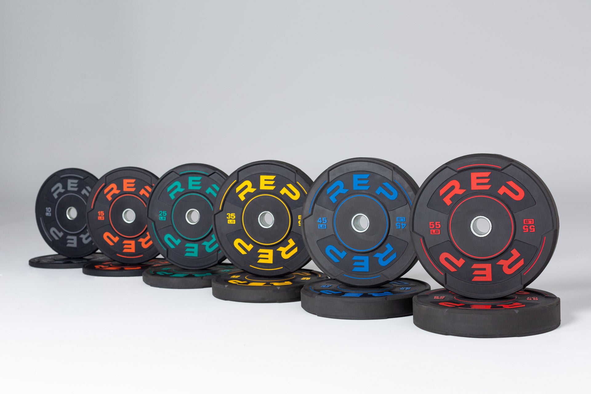 Full set of Sport Bumper Plate Pairs: 10, 15, 25, 35, 45, and 55lb pairs.