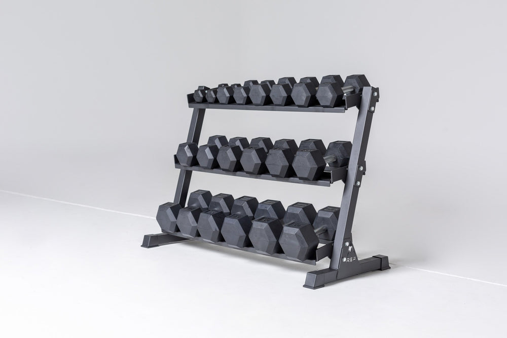 3-tiered matte black REP Dumbbell Rack storing a 5-50 REP dumbbell set.