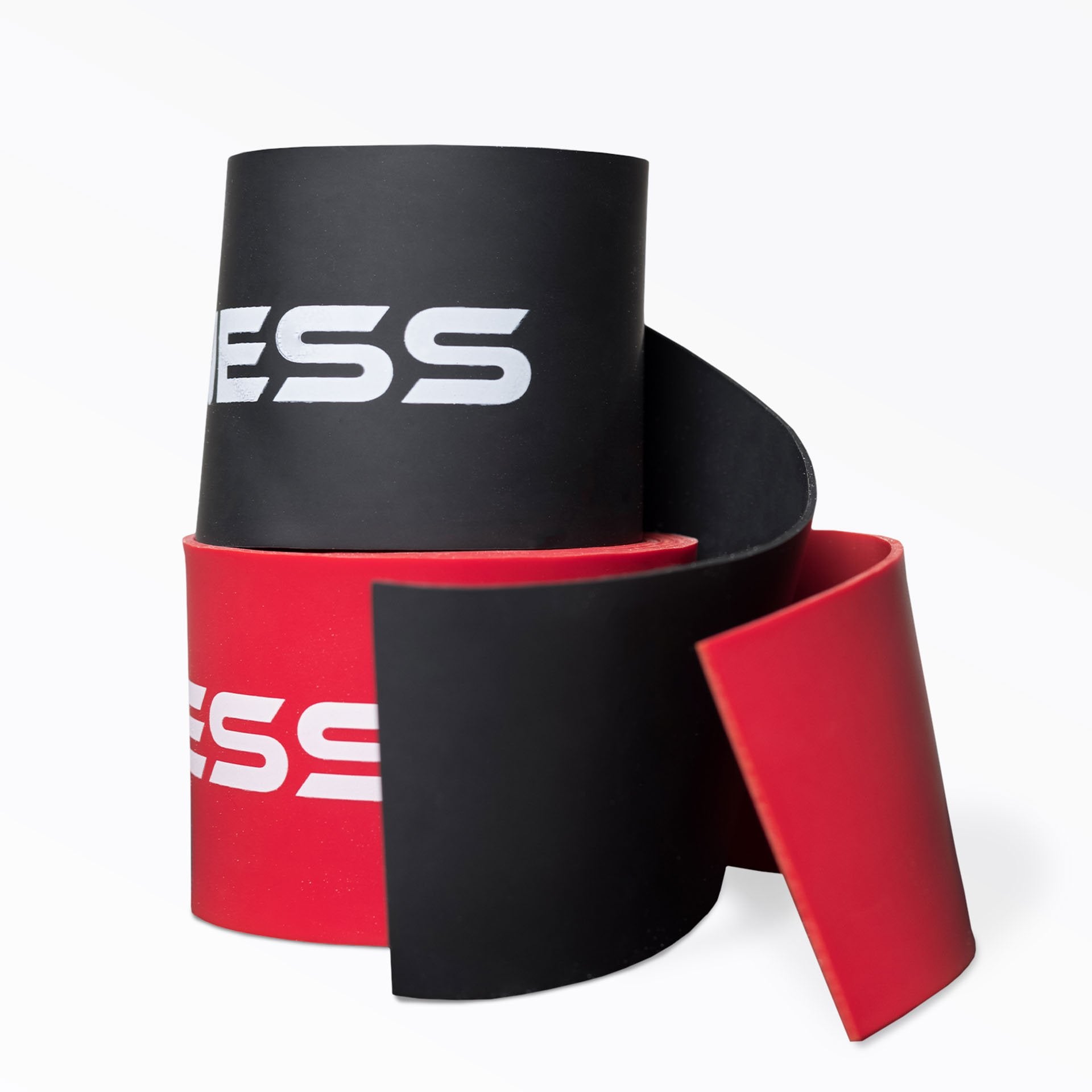 A pair of rolled up stacked REP Floss Bands; black on top and red on bottom.