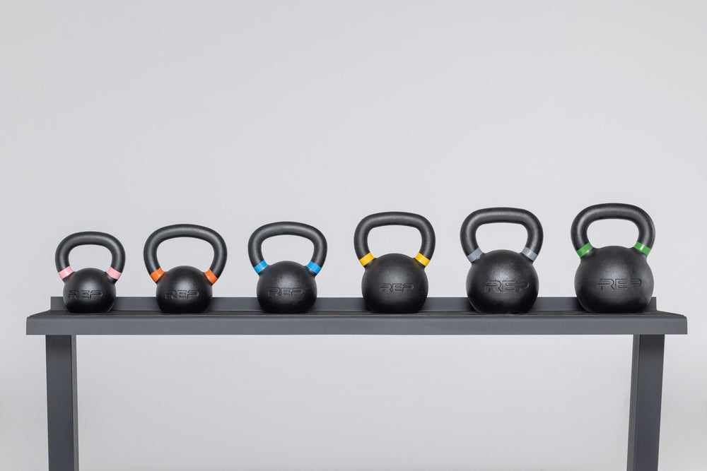 Various kettlebell sizes on a rack