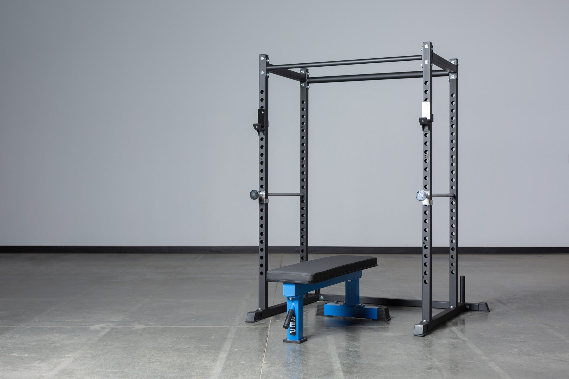 PR-1050 Short Power Rack Pictured With a Flat Bench