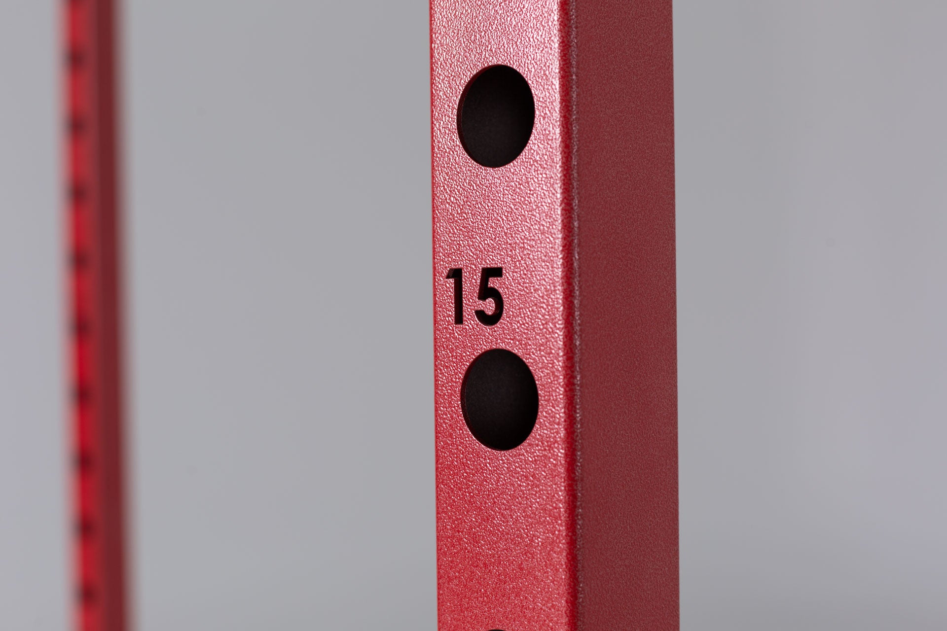 PR-1100 Power Rack in Red. Close up of Rack Upright Holes and Laser-Cut Number)