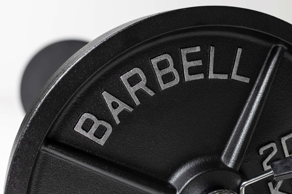 Close up view of the word "BARBELL" in silver lettering on a 45lb Old School Iron Plate.