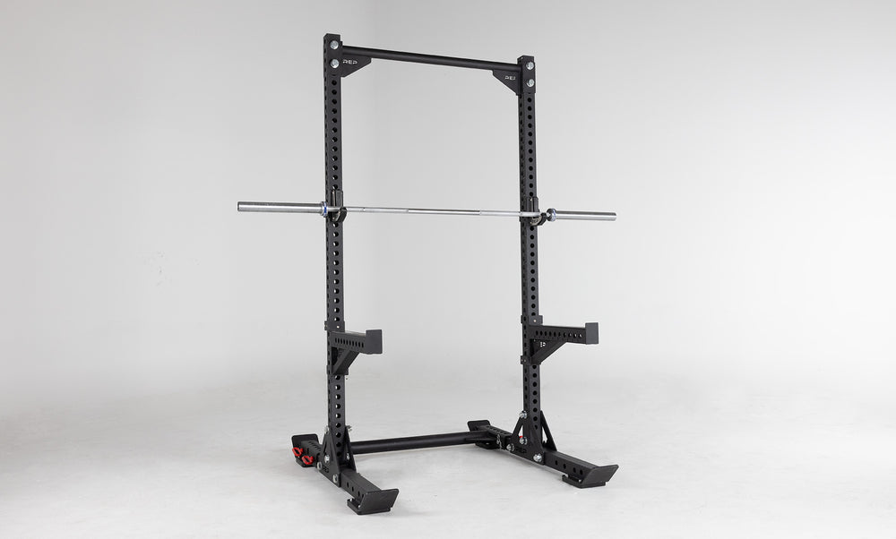 Oxylus Yoke UHMW Liners on Oxylus Yoke With Pull-Up Bar, Spotter Arms, and J-Cups Holding a Barbell